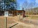 Rustic barn with covered stalls for animals at 413 Johnson Town Rd, Zebulon, NC 27597