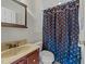 Clean bathroom with toilet, sink, and shower/tub at 413 Johnson Town Rd, Zebulon, NC 27597