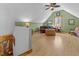 Spacious bonus room with hardwood floors, a ceiling fan, and plenty of natural light at 413 Johnson Town Rd, Zebulon, NC 27597