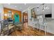 Cozy dining area with rustic log walls and a charming table setting at 413 Johnson Town Rd, Zebulon, NC 27597