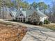 Charming ranch style home features stone accents, inviting front porch, and long driveway at 413 Johnson Town Rd, Zebulon, NC 27597