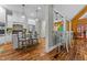 Modern kitchen with white cabinets, hardwood floors, and an island at 413 Johnson Town Rd, Zebulon, NC 27597