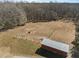 Aerial view of outbuilding and fencing, creating a practical space for various needs at 413 Johnson Town Rd, Zebulon, NC 27597
