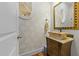Stylish powder room with unique vessel sink and patterned wallpaper at 413 Johnson Town Rd, Zebulon, NC 27597
