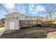 Elevated deck with storage shed and wooded backyard at 420 W 10Th St, Siler City, NC 27344