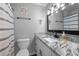 Clean bathroom with granite countertop and modern vanity at 420 W 10Th St, Siler City, NC 27344