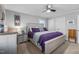 Large bedroom with king bed, dresser, and ceiling fan at 420 W 10Th St, Siler City, NC 27344