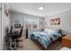 Cozy bedroom with a gaming setup and plenty of natural light at 420 W 10Th St, Siler City, NC 27344