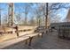Deck with wooden bench and views of the backyard trees at 420 W 10Th St, Siler City, NC 27344