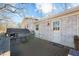 Back deck with table, chairs, and grill at 420 W 10Th St, Siler City, NC 27344
