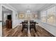 Bright dining room featuring hardwood floors and a charming table set at 420 W 10Th St, Siler City, NC 27344