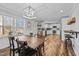 Farmhouse style dining room with wooden table and view into kitchen at 420 W 10Th St, Siler City, NC 27344