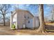 Backyard view of the house, including a shed and propane tank at 420 W 10Th St, Siler City, NC 27344