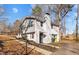 Side view of the house, showcasing the gray and white brick exterior at 420 W 10Th St, Siler City, NC 27344