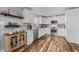 Updated kitchen boasts white cabinets, granite countertops and stainless steel appliances at 420 W 10Th St, Siler City, NC 27344