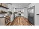 Modern kitchen with white cabinets, granite countertops and stainless steel appliances at 420 W 10Th St, Siler City, NC 27344