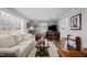 Bright living room with hardwood floors, neutral decor, and ample natural light at 420 W 10Th St, Siler City, NC 27344