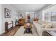 Living room with hardwood floors, neutral color palette and plenty of natural light at 420 W 10Th St, Siler City, NC 27344