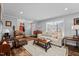 Spacious living room with hardwood floors, comfortable furniture and large windows at 420 W 10Th St, Siler City, NC 27344
