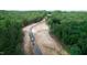 Aerial view of road construction in a wooded area at 432 Firefly Overlook, Pittsboro, NC 27312
