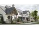Stunning house exterior boasts a spacious backyard, stone patio, and walkway at 432 Firefly Overlook, Pittsboro, NC 27312