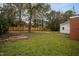 Grassy backyard featuring a new wooden fence and surrounding trees at 601 Rose St, Rocky Mount, NC 27801