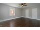 Light and bright bedroom features hardwood floors, neutral walls, an updated window and two closets at 601 Rose St, Rocky Mount, NC 27801