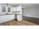 Modern kitchen with white cabinets, butcher block countertops, and stainless steel dishwasher at 601 Rose St, Rocky Mount, NC 27801