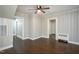 The living area with wood floors, neutral paint, and multiple doorways at 601 Rose St, Rocky Mount, NC 27801