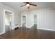 Bright living room features hardwood floors, neutral walls, and an updated ceiling fan fixture at 601 Rose St, Rocky Mount, NC 27801