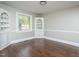 Elegant living room with custom built-ins and gleaming hardwood floors at 601 Rose St, Rocky Mount, NC 27801