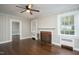 Charming living room with fireplace, hardwood floors, and bright windows at 601 Rose St, Rocky Mount, NC 27801