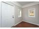 Mud room featuring a white door, white trim, and windows at 601 Rose St, Rocky Mount, NC 27801