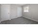 Charming bedroom with grey carpet, and neutral walls at 609 E Cockrell St, Nashville, NC 27856