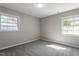 Bright bedroom with neutral walls and grey carpeting at 609 E Cockrell St, Nashville, NC 27856