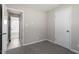 Spacious bedroom with grey carpet and access to bathroom at 609 E Cockrell St, Nashville, NC 27856