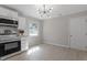 Updated kitchen with stainless steel appliances and light grey vinyl flooring at 609 E Cockrell St, Nashville, NC 27856