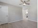 Open living room with wood-look floors and a view into the kitchen at 609 E Cockrell St, Nashville, NC 27856