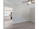 Open living room with view of kitchen and wood-look floors at 609 E Cockrell St, Nashville, NC 27856
