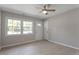 Living room with wood-look floors, neutral walls and a door to the outside at 609 E Cockrell St, Nashville, NC 27856