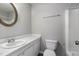The bathroom features a toilet, vanity with sink, and tub shower combo at 635 Pine Ridge Pl, Raleigh, NC 27609