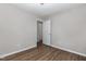 Bedroom boasts wood-look flooring and neutral tones, ready for your personal touch at 635 Pine Ridge Pl, Raleigh, NC 27609