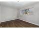 Cozy bedroom features wood-look floors and a bright window, ready for customization at 635 Pine Ridge Pl, Raleigh, NC 27609