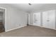 Comfortable bedroom with plush carpeting, offering a cozy space and convenient closet access at 635 Pine Ridge Pl, Raleigh, NC 27609