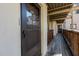 Exterior of an apartment entryway with a screen door and wooden porch at 635 Pine Ridge Pl, Raleigh, NC 27609