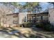 Exterior of a multi-story apartment complex with wood siding and mature trees at 635 Pine Ridge Pl, Raleigh, NC 27609