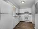 Functional kitchen with white appliances and ample cabinet space for storage at 635 Pine Ridge Pl, Raleigh, NC 27609