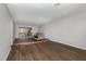 Spacious living area offers a deck with natural views, cozy seating, and wood flooring at 635 Pine Ridge Pl, Raleigh, NC 27609