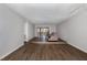 Large living room with a step-up sitting area and access to an outdoor space at 635 Pine Ridge Pl, Raleigh, NC 27609