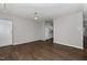 Open-concept living room with hard surface floors, and easy access to the kitchen at 635 Pine Ridge Pl, Raleigh, NC 27609